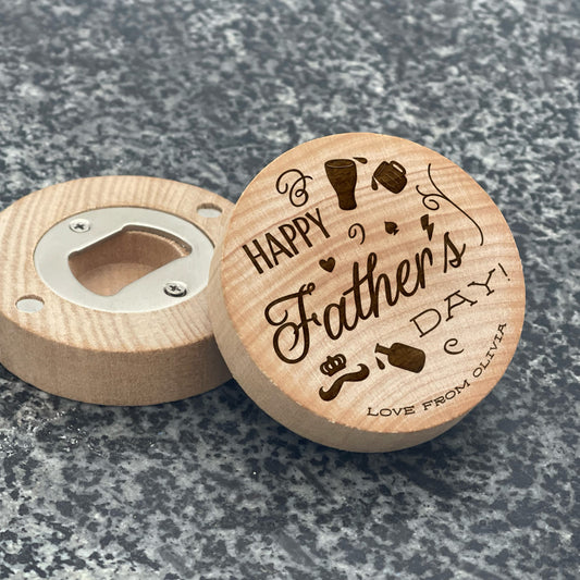 Father's Day Bottle Opener: Happy Father's Day. Pictured showing the engraved front and magnetic bottle opener back, on a stone countertop