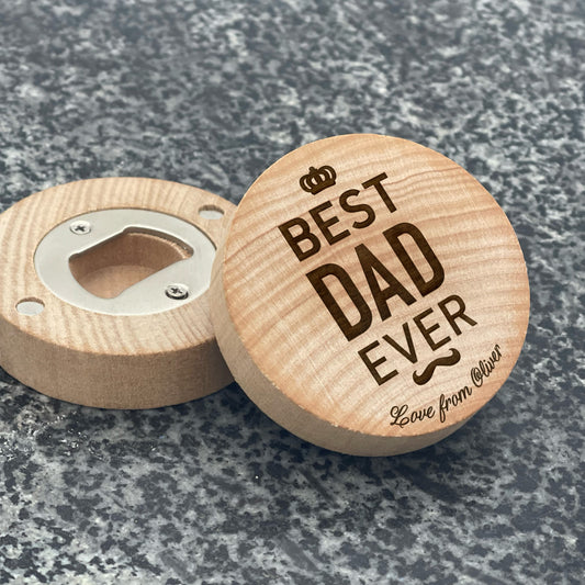 Father's Day Bottle Opener: BEST DAD EVER. Pictured showing the engraved front and magnetic bottle opener back, on a stone countertop