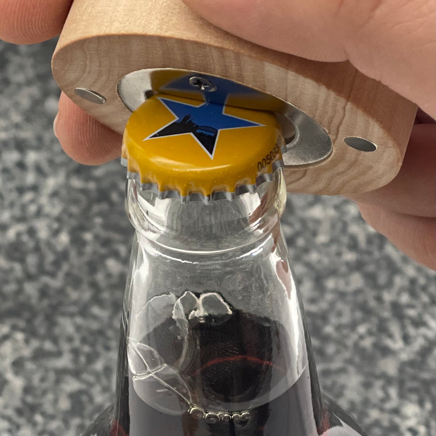 Father's Day Bottle Opener: BEST DAD EVER. Showing the use on a glass bottle cap